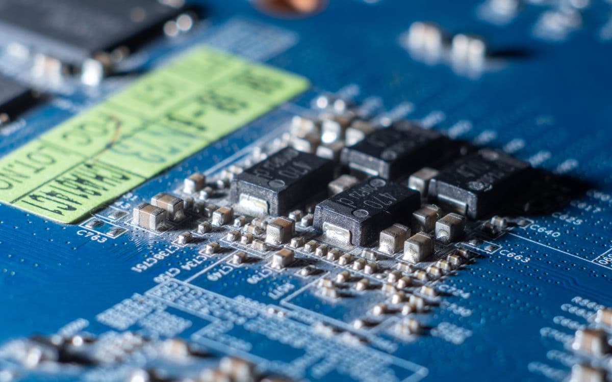 Macro photograph of a blue circuit board
