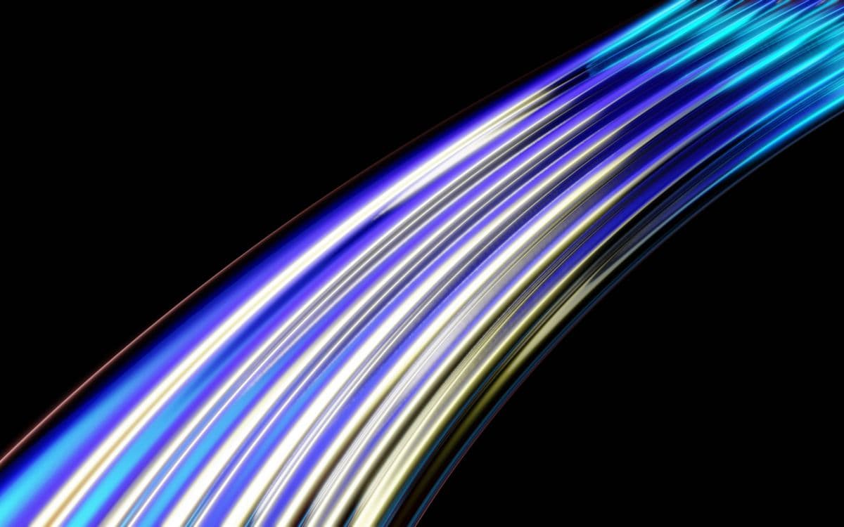 Curved blue light trails on a dark background